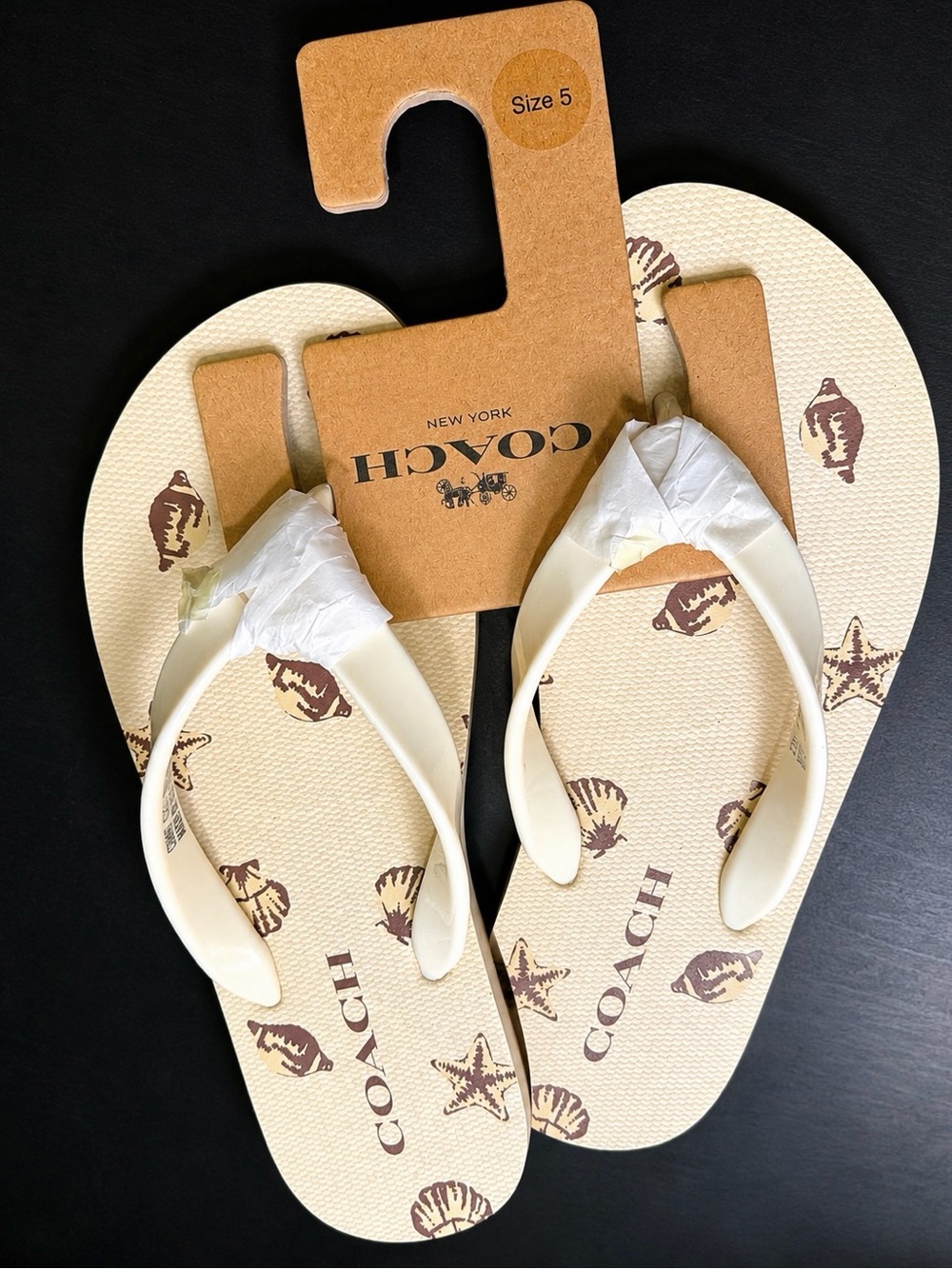 Coach Cream Flip Flops with Brown Shell Motif